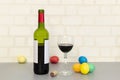 Church red wine on the table and a glass. Painted eggs Royalty Free Stock Photo