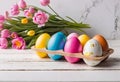 Easter decorations, colorfully painted and decorated Easter eggs and spring flowers on a wood background Royalty Free Stock Photo