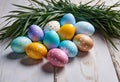 Easter decorations, colorfully painted and decorated Easter eggs and spring flowers on a wood background Royalty Free Stock Photo