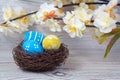 Easter decorations. Eggs in nests on wood