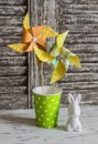 Easter decorations - homemade paper pinwheels and ceramic Easter Bunny