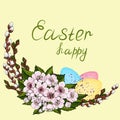 Easter decorations from young willow branches, decorated with multicolored Easter eggs and pink cherry flowers with a wish for a