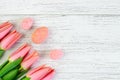 Easter decorative eggs with tulips on a white background from boards. Royalty Free Stock Photo