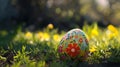 Easter designer egg on grass with blur background