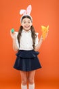 Easter dinner. easter carrot recipes. stay healthy and happy. small girl hold carrot and eggs. egg hunt began. child in