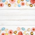 Easter double border with eggs, paper flowers and wooden bunnies against a square white wood background