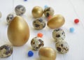 Easter. Easter eggs of gold and natural color on a light background