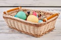 Easter egg basket on wood. Royalty Free Stock Photo