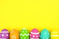 Easter egg bottom border over yellow paper background