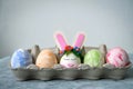 Easter egg card painted eggs and one egg decorated with bunny ears Royalty Free Stock Photo