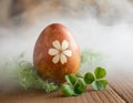 Easter egg colored naturally with onion skins decorated with leaf pattern Royalty Free Stock Photo