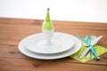 Easter egg in cup holder, plates and cutlery Royalty Free Stock Photo