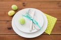 Easter egg in cup holder, plates and cutlery Royalty Free Stock Photo