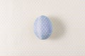 Easter egg decorated with blue paper napkin. Royalty Free Stock Photo