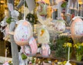 Easter egg decorations with bunny designs hanging on display in spring floral shop Royalty Free Stock Photo