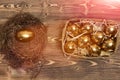 Bird nest, box with traditional golden eggs on wood, antique Royalty Free Stock Photo