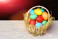 Spring easter holiday celebration with colorful eggs in basket Royalty Free Stock Photo