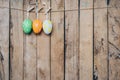 Easter egg hanging clothseline on wood backhround with space Royalty Free Stock Photo