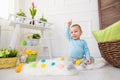 Easter egg hunt. Adorable child playing with Easter eggs at home Royalty Free Stock Photo