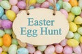 Easter Egg Hunt sign with candy eggs Royalty Free Stock Photo
