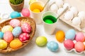 Easter egg painting at the kitchen table. Royalty Free Stock Photo