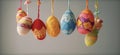 Easter egg shaped cotton thread handcrafts hanging from top. Concept of happy easter day