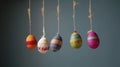 Easter egg shaped cotton thread handcrafts hanging from top. Concept of happy easter day