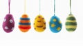Easter egg shaped cotton thread handcrafts hanging from top. Concept of happy easter day