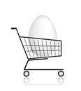 Easter egg in shopping cart for your design Royalty Free Stock Photo