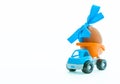 Easter egg and toy car - truck on white background, happy easter day concept, space for text Royalty Free Stock Photo