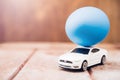 Easter egg and toy car on wooden background Royalty Free Stock Photo