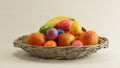 Easter eggs apples bananas basket Royalty Free Stock Photo