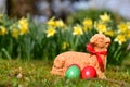 Easter eggs and a baked Easter lamb in a meadow