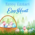 Easter eggs in the basket Background with field of trees and colored eggs in the grass Royalty Free Stock Photo