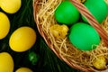 Easter eggs in the basket and with fake grass