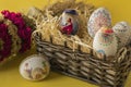 Easter eggs in a basket and a palm tree Royalty Free Stock Photo