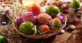 Easter Eggs in a Basket on a Table during Easter. Royalty Free Stock Photo