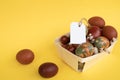 Easter Eggs in Basket with Tag Royalty Free Stock Photo