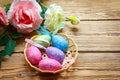 Easter eggs in the basket of wooden boards Royalty Free Stock Photo