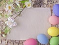 Easter eggs and blank note Royalty Free Stock Photo