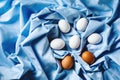 Easter eggs on blue textile draped background Royalty Free Stock Photo