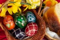 Easter eggs and Easter bun with flowers - red background