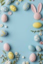 Easter eggs and Easter bunny ears on a blue background greeting card with copyspace copy space portrait format Royalty Free Stock Photo