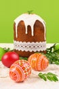 Easter eggs and cake with a boxwood branch Royalty Free Stock Photo