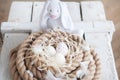Easter, eggs, chicken eggs, quail eggs, eggs, rope, nest, white, feathers,in the hay,white rabbit, easter rabbit Royalty Free Stock Photo