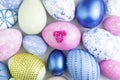 Easter eggs collection. Chicken eggs are painted in blue, pink, green, with rhinestones. Creative card with Easter. View from