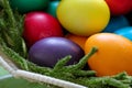 Easter Eggs. Colored Easter Eggs in a Basket. Easter Egg in Nest on Vintage Background