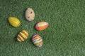 Easter eggs colored on grass wide view or top view