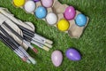 Easter eggs colored on grass wide view or top view