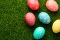 Easter eggs colored on green grass. Congratulations on Easter. Horizontal frame Royalty Free Stock Photo